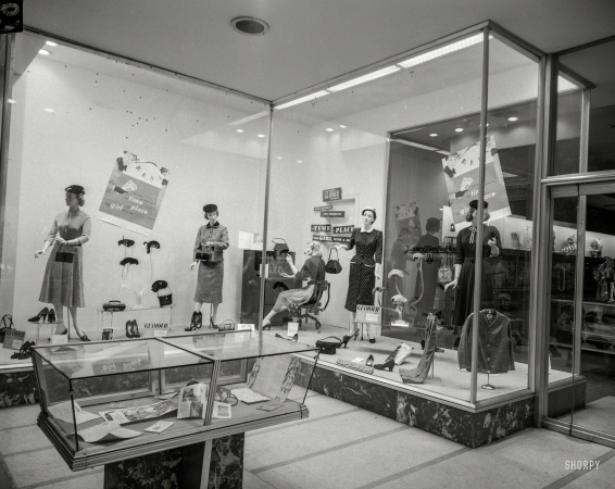 Photo showing: The Girl With a Job -- Columbus, Georgia, circa 1953. Kayser-Lilienthal window display.