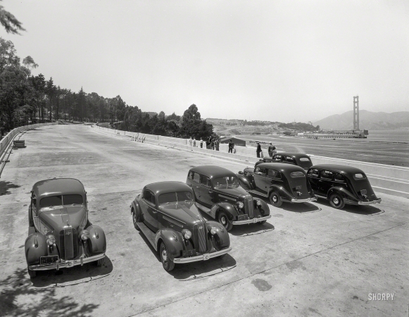 Photo showing: When We Come to It -- San Francisco, 1935. Golden Gate Bridge under construction. Pontiacs on Presidio ramp.
