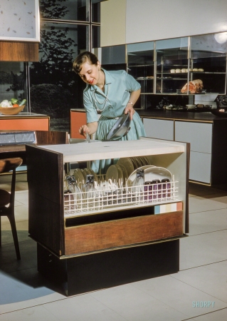 Photo showing: Miracle Dishwasher -- March 1959. Home economist Anne Anderson demonstrating RCA-Whirlpool
'Miracle Kitchen of the Future,' a display at the American National Exhibition in Moscow.