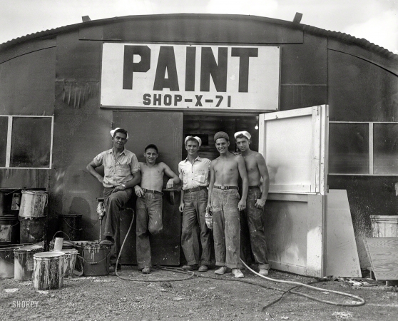 Photo showing: Top Guns. -- Somewhere in the Pacific circa 1945. Navy sailors at paint shop.