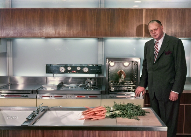 Photo showing: The 24-Carrot Kitchen -- 1954. Harley Earl, General Motors Vice President of Design, in Frigidaire's 'Kitchen of
Tomorrow' exhibit for the GM Motorama at the Waldorf-Astoria Hotel in New York.