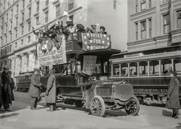 Photo showing: Votes for Women -- February 10, 1913. Washington hikers. Suffragists on bus in New York City ... 