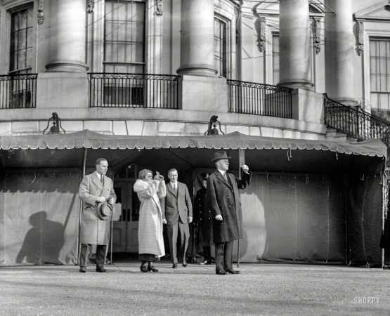Photo showing: Executive Eclipse -- January 24, 1925. President & Mrs. Coolidge viewing eclipse of sun at White House.