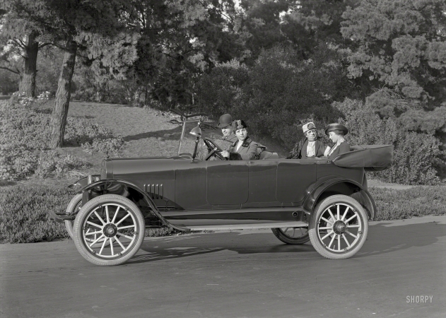 Photo showing: We Really Must Be Going -- San Francisco circa 1917. The Olympian Tourist touring car.