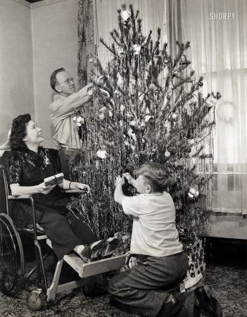 Photo showing: Noel, Iola -- Dec. 23, 1944. Iola Swinnerton Warren with her husband and nephew in Chicago.