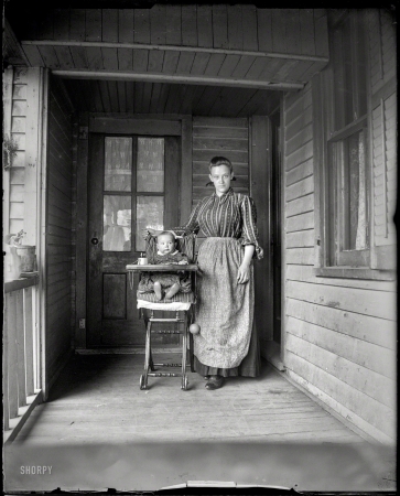 Photo showing: The New Century -- Circa 1900. Lettis -- mother with tot.
