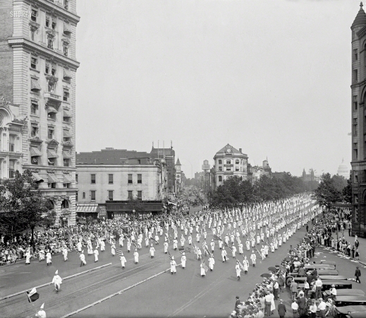 Photo showing: Stripes and Solids -- Washington, D.C. K.K.K. parade on Pennsylvania Avenue, 8/8/25. 