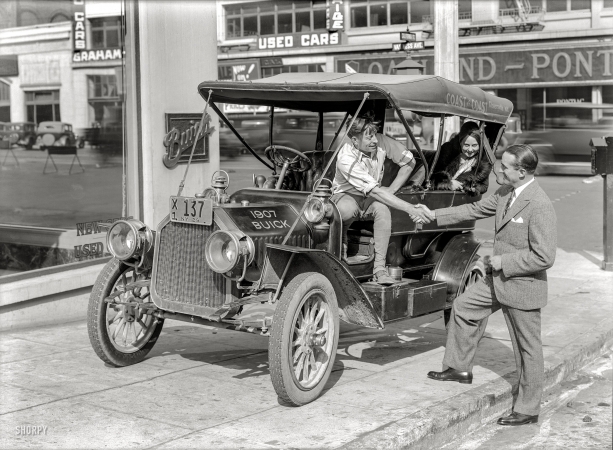 Photo showing: Bicoastal Buick -- 1907 Buick on San Francisco's Auto Row at Van Ness Avenue and California Street in 1929.