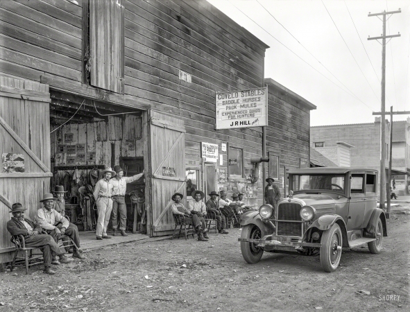 Photo showing: Covelo Stables -- 1925. Indian guides and Nash auto at Covelo stables. Mendocino County, California. Along with</br >
a tin-sign Who's Who of the 1920s soft drink industry, starting with Whistle and its slogan WHIZ-WHIM-WHANG.