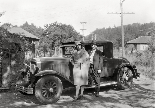Photo showing: Back-Road Buick -- Unidentified couple with Buick, California, 1930.