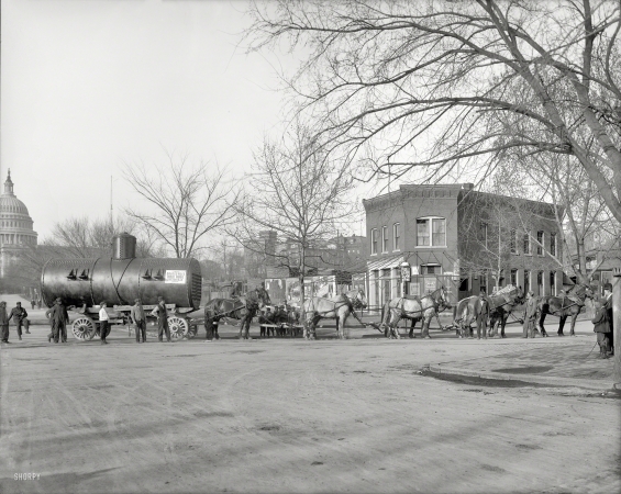 Photo showing: Twelve Horsepower -- Merchants Transfer & Storage Co., Washington, D.C. In 1911, moving
a boiler on D Street within sight of the Capitol with a 12-horse team.