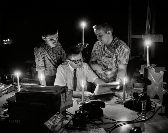 Photo showing: News Blackout -- Circa 1958, the Columbus (Georgia) Ledger-Enquirer city desk during a power outage.