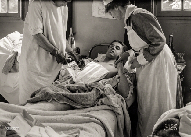 Photo showing: Dressing the Wound -- June 12, 1918. Dressing the wound. American Military Hospital at Neuilly, France (Dr. Johnson).