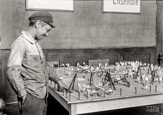 Photo showing: Goals -- July 1918. Alex, a 14-year-old working boy in St. Etienne, France, was found intently studying the playground exhibit
at the Children's Welfare Exhibit of the American Red Cross. He has been working since 11 years of age.