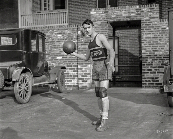 Photo showing: A Taller Baller -- Washington, D.C. Dunn, G.U. '28. Georgetown University forward John Dunn.