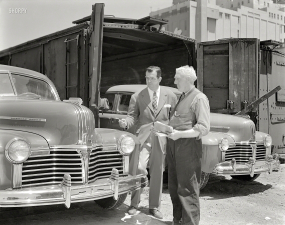 Photo showing: A Pretty Grille -- San Francisco, 1941. Pontiacs being unloaded from freight cars.