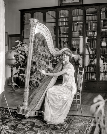 Photo showing: Zing Went the Strings -- Washington, D.C., circa 1911. Mawhinney, M., Miss. Mary Mawhinney at the harp.