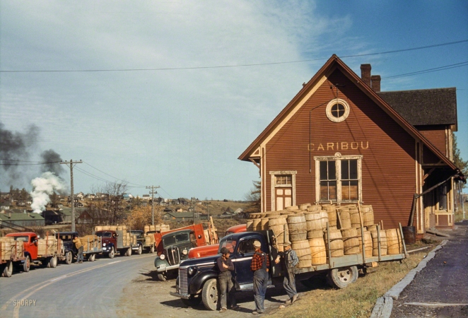 Photo showing: Extra Starch -- October 1940. Potato trucks outside of a starch factory. Caribou, Aroostook County, Maine.