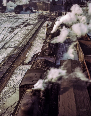Photo showing: Steam Power -- December 1942. Chicago & North Western 40th St. R.R. yard. Locomotives lined up at the coaling station.