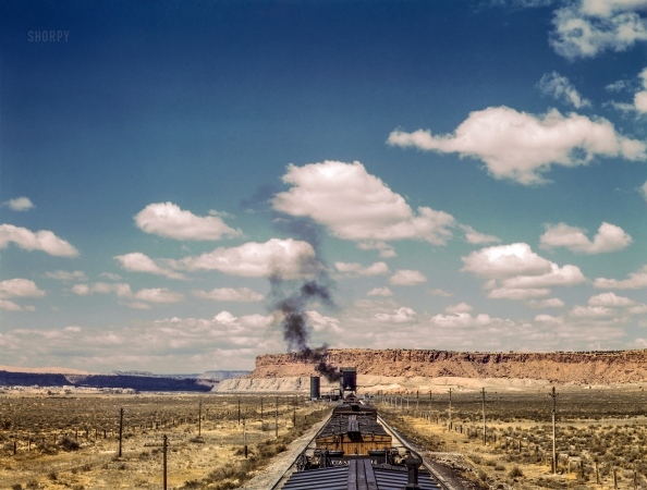 Photo showing: Laguna Layover -- March 1943. Santa Fe R.R. train stopping for coal and water. Laguna, New Mexico.
