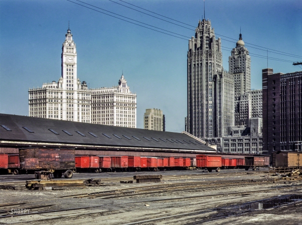 Photo showing: Red Means Go -- April 1943. Chicago. Trucks unloading at the inbound freight house, Illinois Central Railroad, South Water Street freight terminal.