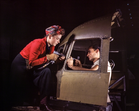 Photo showing: Teamworkers -- October 1942. Riveting team at the Douglas Aircraft plant, Long Beach, Calif., working on a C-47 heavy transport plane.