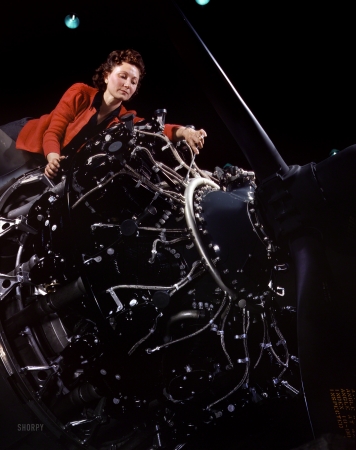 Photo showing: Avenging Angel -- October 1942. Woman working on motor, Douglas Aircraft Company, Long Beach, California.