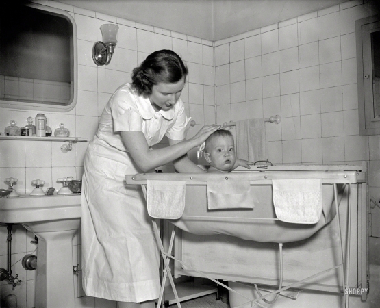 Photo showing: A Fresh Start -- Washington, D.C., 1937. Baby's bath.