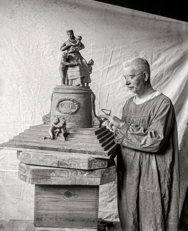 Photo showing: The Mammy Memorial -- Washington, D.C. U.S.J. Dunbar, 6/27/23. The sculptor Ulric Stonewall
Jackson Dunbar and a model of a proposed Mammy monument.