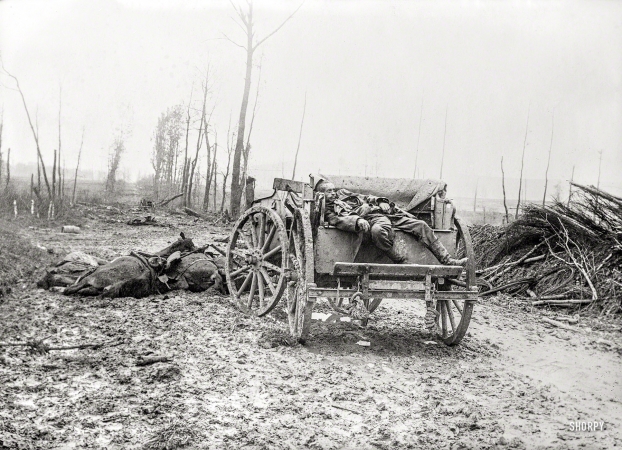 Photo showing: Mud and Guts -- Somewhere in Europe circa 1918. Dead German artilleryman.