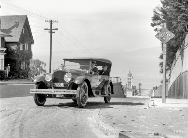 Photo showing: Slippery Danger -- Flint auto, San Francisco, 1924. Ghirardelli Square clock tower in distance.