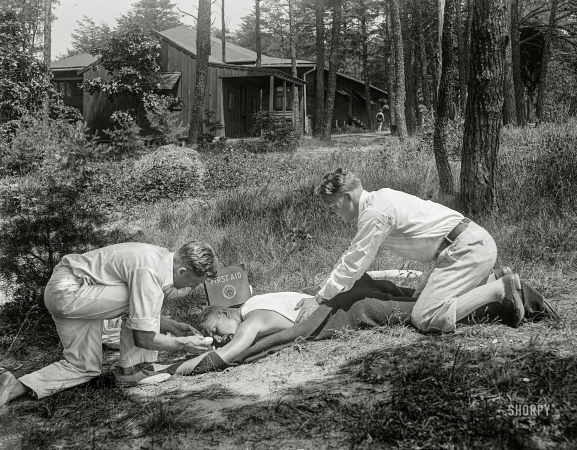 Photo showing: First Aid to the Injured -- Washington, D.C. (vicinity), circa 1919. Giving first aid.