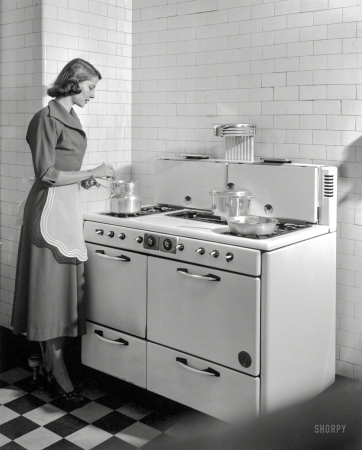 Photo showing: Stirring the Pot. -- New York circa 1948. Homemaker stirring double boiler on gas range.