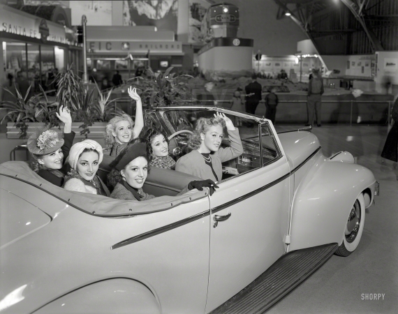 Photo showing: Our Merry Oldsmobile -- 1939. General Motors exhibit, Golden Gate International Exposition, San Francisco. Girls in Oldsmobile convertible coupe.