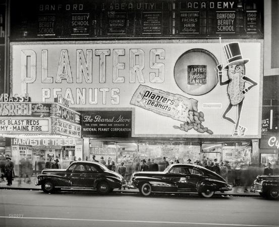 Photo showing: Nut Noir -- New York circa 1947. National Peanut Corp. store on Broadway -- Mr. Peanut sign.