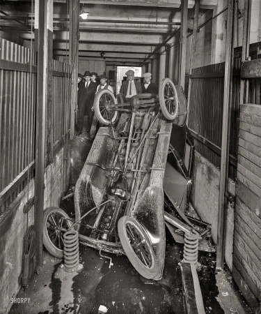 Photo showing: Top-Down Motoring -- Washington, D.C., circa 1920. Garage elevator wreck.
