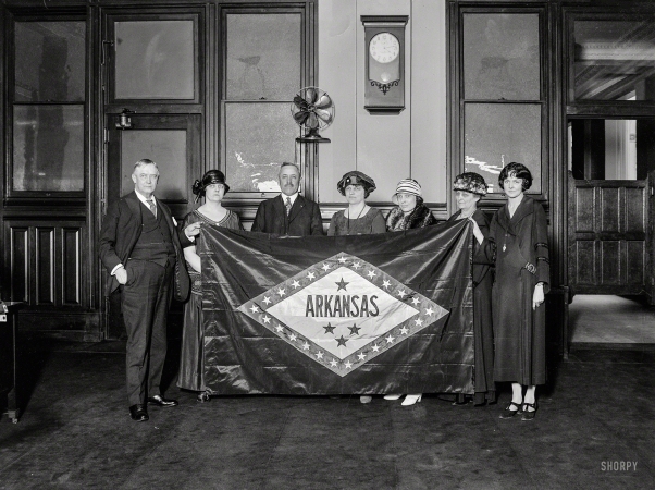 Photo showing: Hail Arkansas -- April 1924. Washington, D.C. Group holding Arkansas state flag.