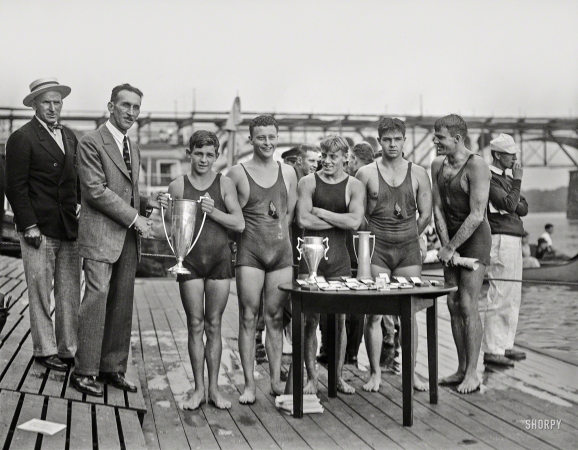 Photo showing: Winning Swimmers -- Aug. 27, 1927. Raymond Ruddy, 15-year-old New York Athletic Club swimmer
who won the race on the Potomac, with members of the victorious team.