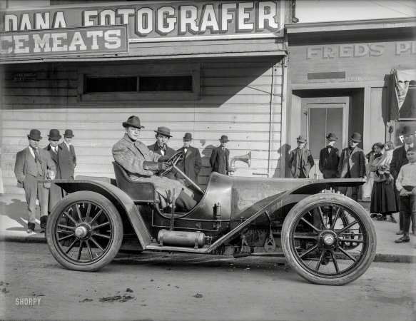 Photo showing: The Michigan Assassin -- San Francisco, 1908. Boxer Stanley Ketchel at wheel of American Underslung auto with manager Britt Willis.