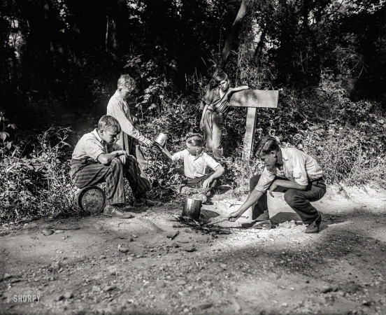 Photo showing: Boys Night Out -- Washington, D.C., or vicinity in 1932. Boys cooking over campfire next to NO TRESPASSING sign.