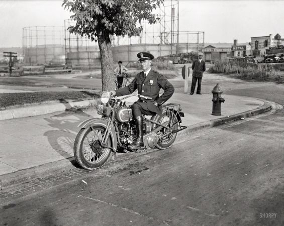 Photo showing: Law & Order -- Washington, D.C., 1932. Metropolitan police officer on motorcycle.