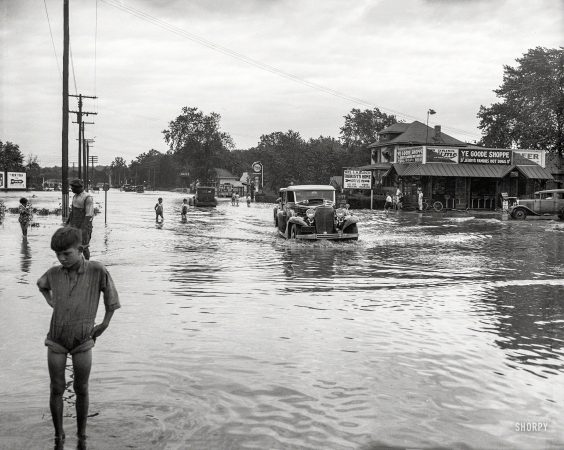 Photo showing: Hurricane Slams D.C. -- Flooding in Washington. Aftermath of the Chesapeake-Potomac storm of August 1933.