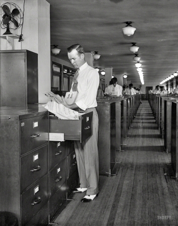 Photo showing: Man, G -- Washington, D.C., circa 1932. Federal Bureau of Investigation. Filing fingerprints and mugshots.