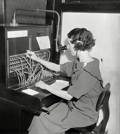 Photo showing: Smooth Operator -- Washington, D.C., 1935. Woman at Western Electric telephone switchboard.