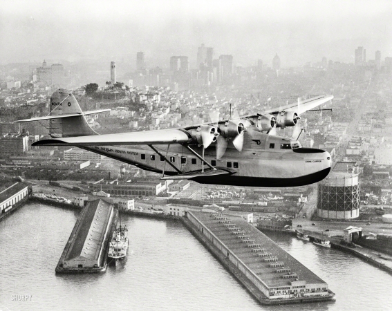 Photo showing: China Clipper -- July 22, 1936. Aerial view of Pan American Airways 'China Clipper' over San Francisco.