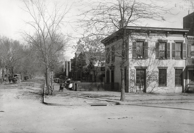 Photo showing: Up First -- Washington, D.C., circa 1901. View of E Street S.W., looking
north up First Street showing Baltimore and Mitchell Book & Job Printers.
