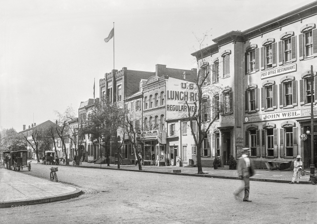 Photo showing: D.C. Police -- Washington circa 1901. Police Station, 12th Street N.W.,
west side, looking south from D Street at Pennsylvania Avenue.