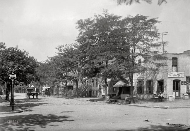 Photo showing: The White Cat -- Washington, D.C., circa 1901. View of C Street N.W., north side, looking west from 12th Street.