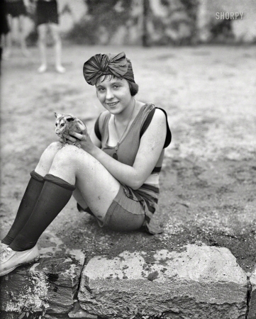 Photo showing: Thoroughly Modern. -- July 1922. Mildred Kapleck with her pet opossum at the Tidal Basin bathing beach.