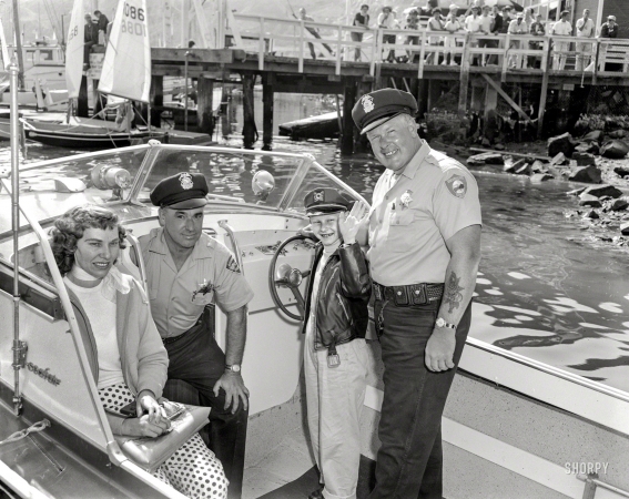 Photo showing: Harbor Patrol -- Richmond, California, 1960. Harbor Patrol. Helming a Glasspar Seafair.